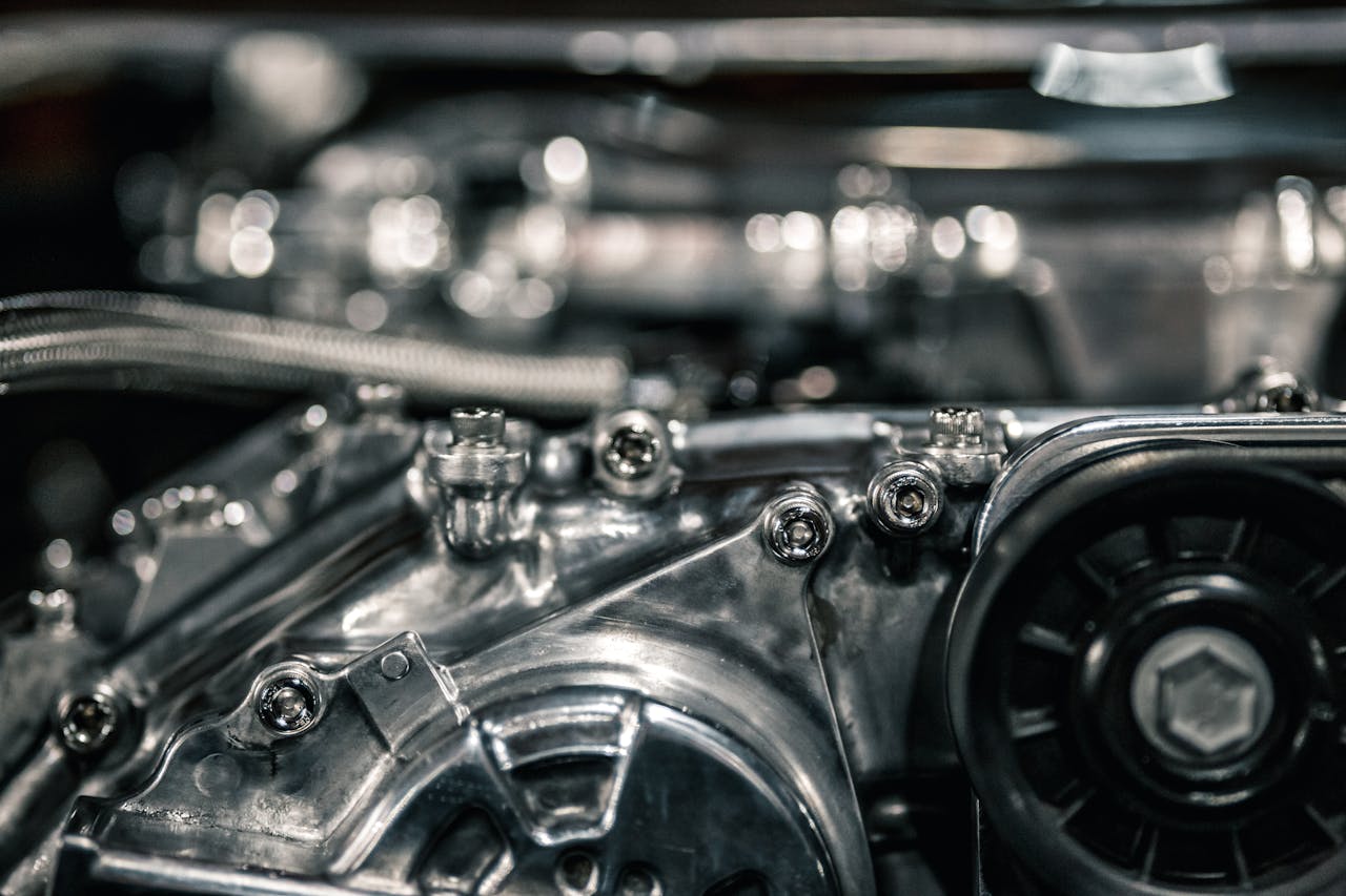 services-01 Detailed view of a shiny and modern automotive engine with metal components.